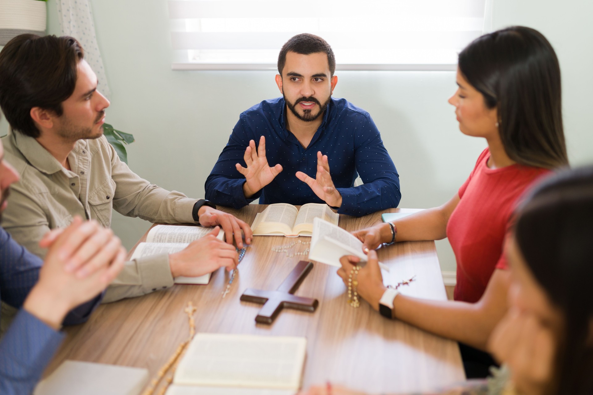 Diverse people studying the holy Bible